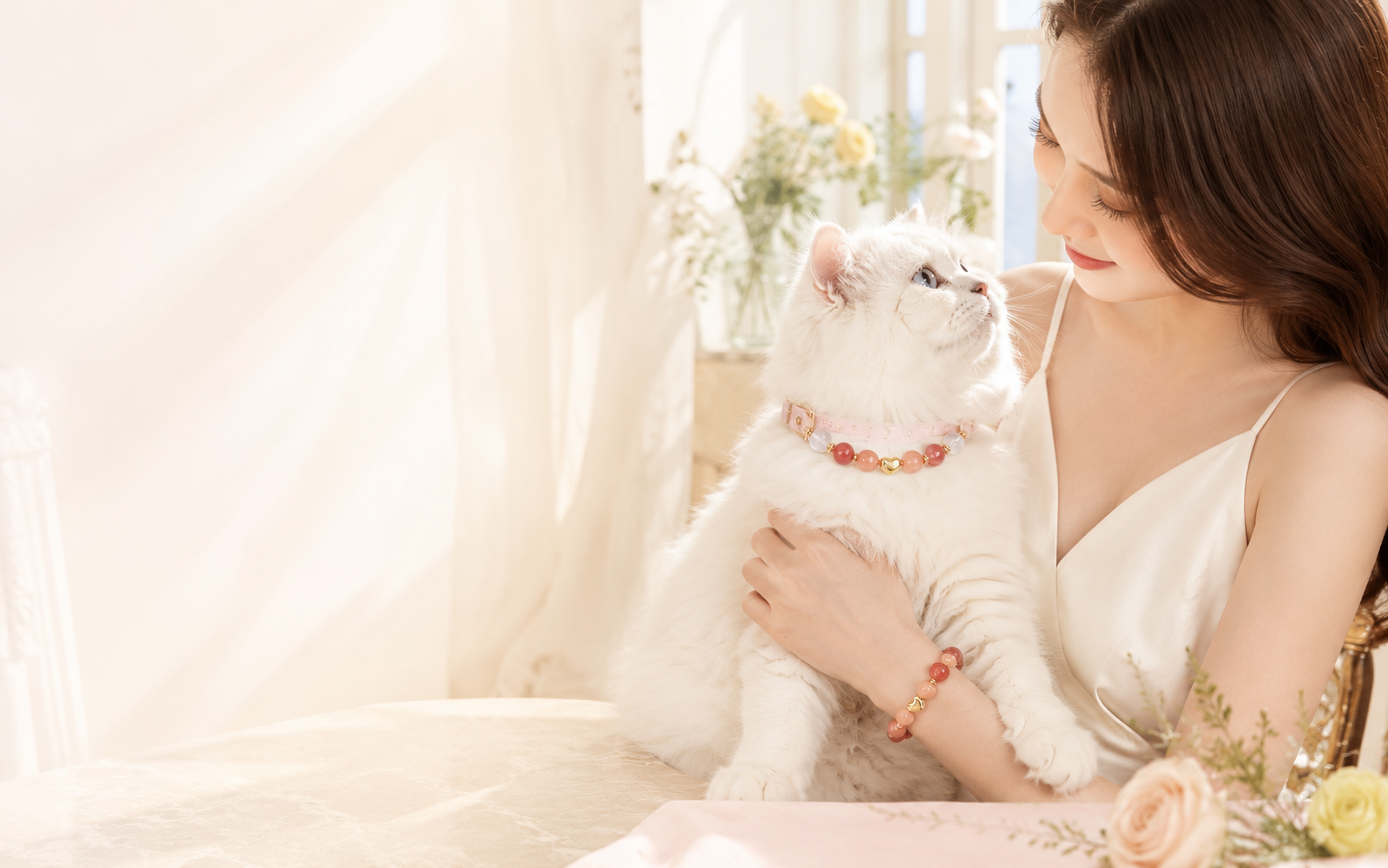 A pet and owner wearing coordinated keepsake jewelry